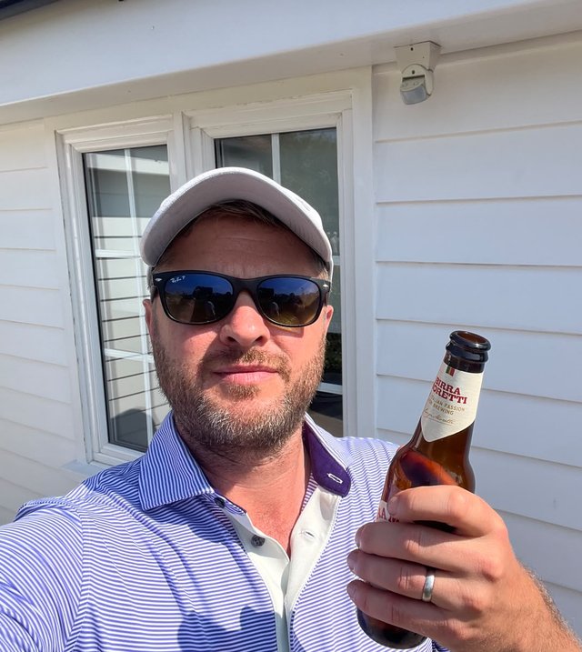 Nick, from Wirral Home & Garden, holding a beer
